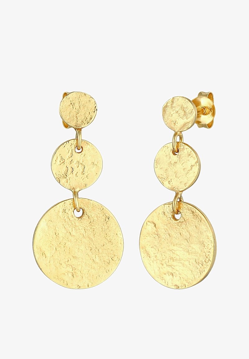 Boucles d'oreilles pendantes ton or avec trois disques circulaires texturés et connectés de taille croissante sur fond blanc.