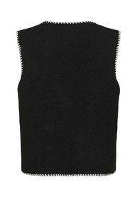 Pull noir sans manches avec des coutures blanches en zigzag le long des bords. Texture douce, forme rectangulaire et design minimaliste.