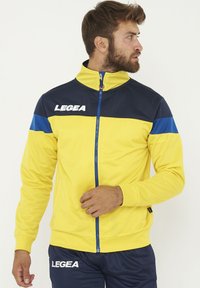 Unselected, giallo/blu