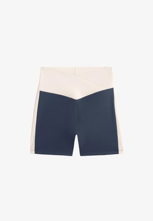 High-waisted athletic shorts with a crisscross light beige waistband and dark navy body, designed for a snug fit.