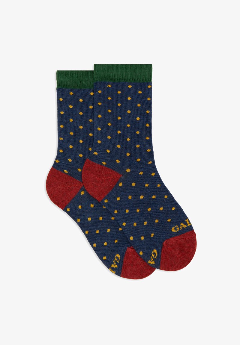 Calzini blu marina con pois gialli, polsini a coste verdi e accenti rossi sulla punta e sul tallone. Realizzati in tessuto morbido e testurizzato. Nome del marchio visibile.