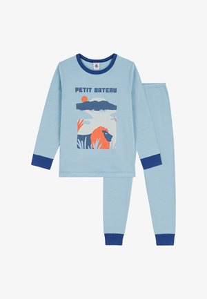 Light blue pajama set with long sleeves and pants. Features a colorful graphic of a landscape and a lion, accented with dark blue cuffs.