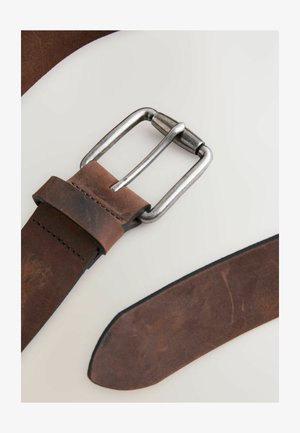 Brown leather belt featuring a silver metal buckle, smooth texture, and a neatly stitched edge. The end of the belt is tapered.