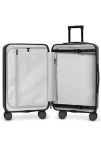 Black hard-shell suitcase with a textured exterior, gray interior, dual compartments, zipper closures, and four wheels for mobility.