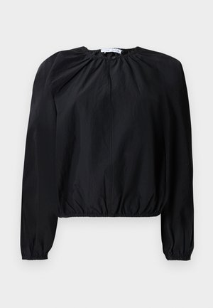 Black cropped blouse with long, puffed sleeves. Made of lightweight fabric, featuring a gathered neckline and elasticated hem for a fitted look.
