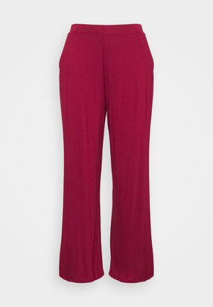 Rode wijde broek met elastische tailleband en zijzakken, weergegeven tegen een effen witte achtergrond.