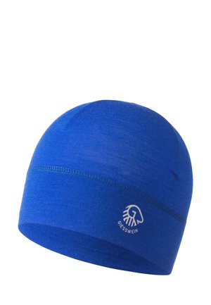 Niebieska wełniana czapka beanie o gładkiej fakturze, zaokrąglonym szczycie i lekkim rozciągnięciu. Posiada białe logo z przodu.