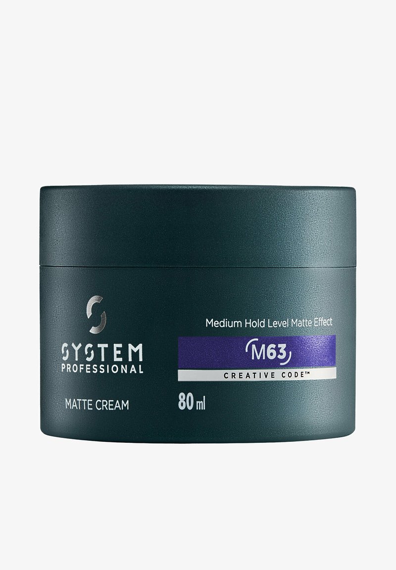 Dunkelgrüner, matter Cremetiegel mit der Aufschrift "SYSTEM PROFESSIONAL". Enthält 80 ml, mit einem lila Akzentband und weißem Text, der die Produktdetails angibt.