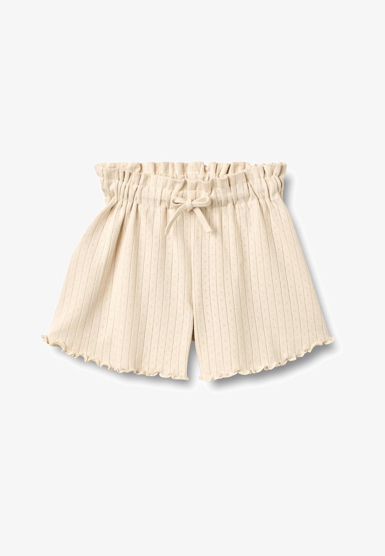 Shorts en tissu côtelé beige avec taille élastique froncée, lien à nouer à l'avant et bords d'ourlet festonnés.