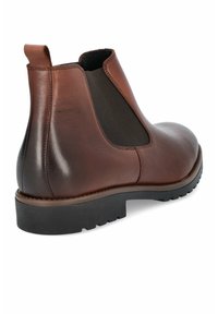 Brązowe skórzane botki typu Chelsea z elastycznymi bocznymi panelami, zaokrąglonym noskiem i teksturowaną czarną gumową podeszwą. Gładkie wykończenie z subtelnym połyskiem.