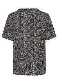 Chemise noire à manches courtes avec un motif composé de petites feuilles blanches abstraites sur toute la surface, vue de dos sur fond blanc.