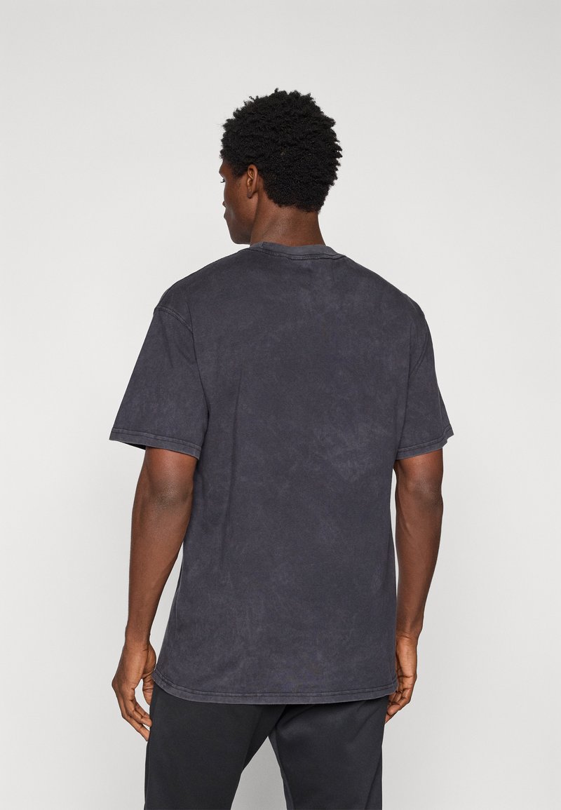Nike Performance TEE TRAIN - Triko s potiskem - black
