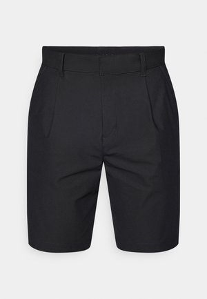 Svarte shorts laget av et glatt, lett stoff. Har en flat front, sidelommer og elastisk midjebånd for komfort.