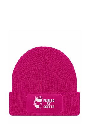 Pink knit beanie with a folded cuff. Features a rectangular patch displaying "FUELED BY COFFEE" and a graphic of a coffee cup in white.