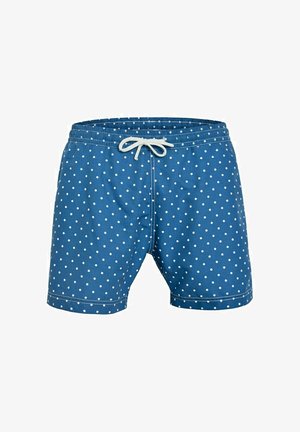 Short de bain bleu à pois blancs avec un cordon blanc à la taille élastique, présenté sur un fond blanc uni.