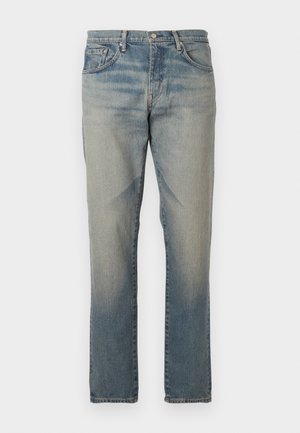 Lyseblå denimjeans med en falmet finish og lige ben. Har standardlommer, knaplukning og subtile syninger.