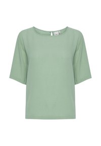 Voľný krátky rukáv top v svetlozelené farbe, s okrúhlym výstrihom a detailom v tvare kľúča na zadnej strane. Vyrobené z hladkej, jemnej tkaniny.
