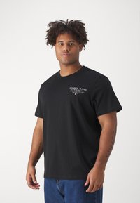 Tommy Jeans SLIM ESSENTIAL GRAPHIC TEE - Marškinėliai su spaudiniu - black