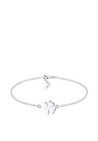 Bracelet délicat en chaîne argentée avec un charm en trèfle à quatre feuilles poli et une fermeture à homard réglable.