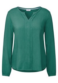 Blusa verde a maniche lunghe con scollatura a V, realizzata in un tessuto testurizzato con una leggera lucentezza, polsini arricciati e un dettaglio della cucitura centrale.