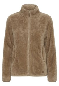 Fuzzy zip-up fleece jacket in a tan color with a high collar, side pockets, and a textured surface. Features subtle logo detail at the hem.