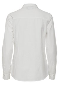 Camicia bianca a maniche lunghe in cotone. Caratterizzata da un colletto classico, polsini con bottone e una fessura sul retro, con una texture liscia.