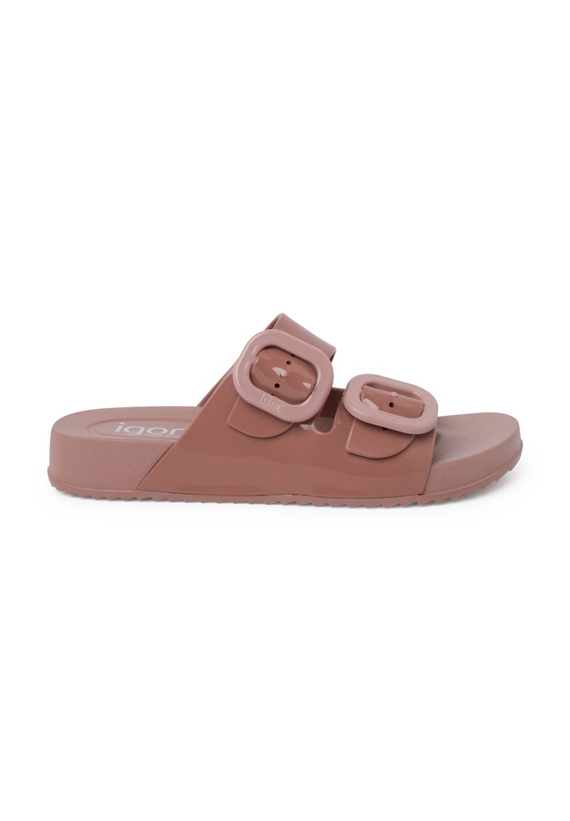 Brown flat slide sandal with two large adjustable buckles, made of glossy material, featuring a textured sole for grip and comfort.