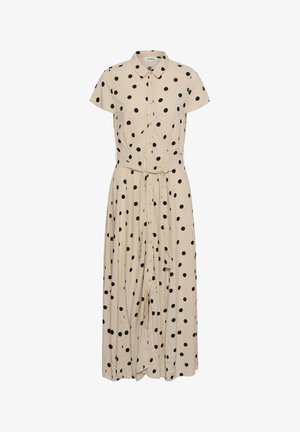 Beiges kurzärmeliges Hemdkleid mit schwarzen Punkten, einem Kragen und einem Stoffgürtel, der in der Taille gebunden ist und bis zum Knöchel reicht.