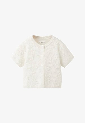 Kratki kardigan krem boje od teksturirane tkanine, s cvjetnim vezom i pet prednjih dugmadi.
