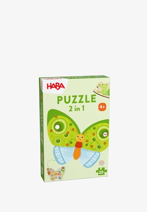HABA 2-in-1 butterfly puzzle box, featuring vibrant green and blue patterns, with a central insect illustration. Puzzle piece graphic included.
