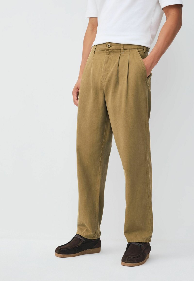 Khaki pleated trousers with a straight fit, made from textured fabric. Features side pockets and a single button fastening at the waist.