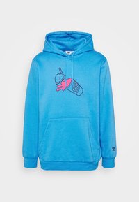 Blå huvtröja med en central grafik av en rosa hand som håller en dryckeskopp, med en framficka och ribbade muddar.