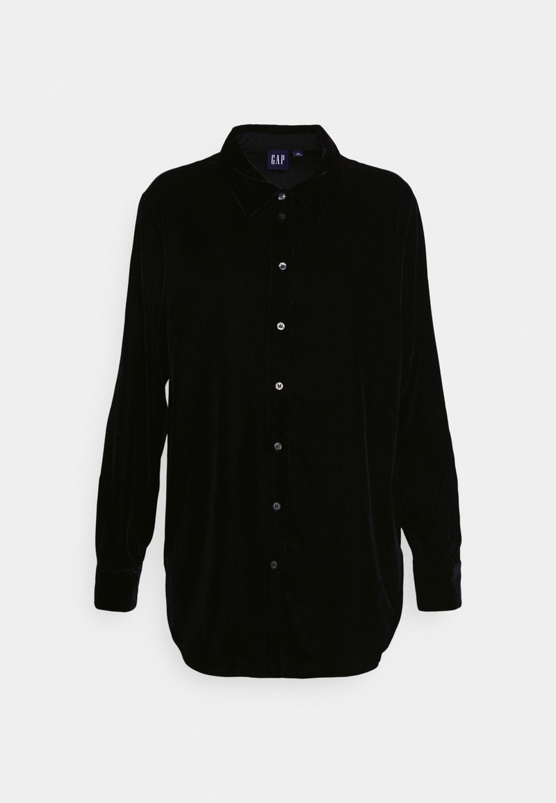 Camicia a maniche lunghe in velluto nero con bottoni sul davanti, colletto a punta e maniche con polsini; texture liscia e vestibilità comoda.