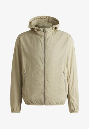Lightweight beige jacket with a hood, zip front, elastic cuffs, and two side pockets. Made from a textured, wrinkle-resistant material.