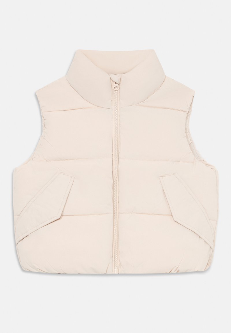 Šviesiai gelsvas paminkštintas liemenė su aukštu kaklu, priekiniais užtrauktukais ir dviem šoninėmis kišenėmis. Lygus paviršius ir šiek tiek siuvinėtas dizainas.