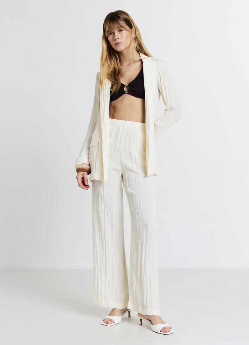 Calliope CRINKLE TINTA UNITA - Pantaloni - ecru chiaro