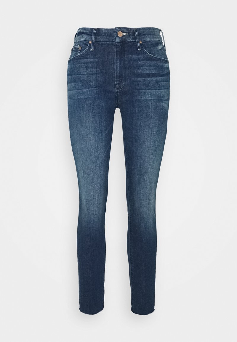 Jeans skinny azul oscuro en tejido de mezclilla, con una alta cintura, diseño de cinco bolsillos y un sutil desgastado en los muslos para dar detalle.