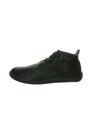 Black leather shoe with a smooth texture, round toe, low profile, and a lace-up design. Features a flexible rubber sole and a back tab.