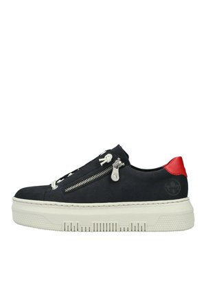 Black canvas sneaker with a white platform sole, featuring a side zipper, white laces, and a red heel accent.