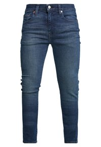 Jeans ajustados azul oscuro con una textura de denim suave, que cuentan con un cierre frontal de botón, cinco bolsillos y un ligero desteñido en las piernas.