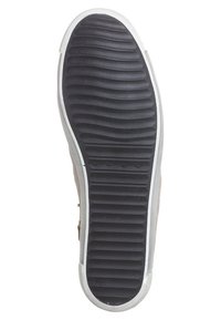 Sole of a sneaker with black rubber tread, horizontal grooves across heel and forefoot, white edge trim, and small embossed logos near midsole.