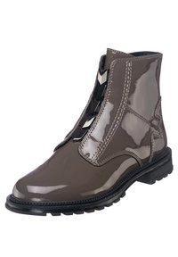 Stivaletto alla caviglia in pelle verniciata taupe lucida con dettagli a cerniera zigzag e suola in gomma nera. Presenta cuciture decorative e un accento a forma di stella.