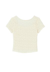 Crop top à manches courtes en dentelle crème, avec un motif floral et un col rond. Le matériau est transparent avec une finition texturée.