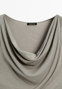 Gray draped top with a wide neckline, made of soft fabric; features a label reading "Massimo Dutti" near the collar.