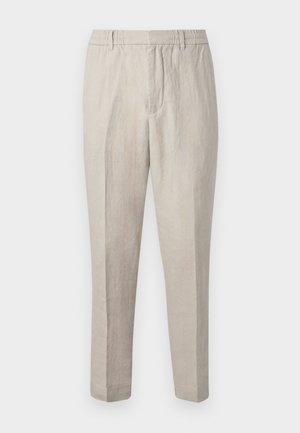Pantalons en lin beige clair avec une coupe décontractée, dotés d'une taille à cordon, de jambes fuselées et d'une texture subtile sur l'ensemble du tissu.