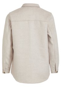 Beige langærmet skjorte lavet af struktureret stof, med en standard krave og knapper på mansjetterne, samt en rundet kant forneden.