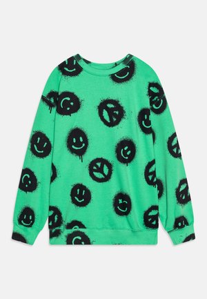 Sweat-shirt vert avec un motif de visages souriants noirs et de signes de paix, avec une texture douce et des poignets et ourlet côtelés.