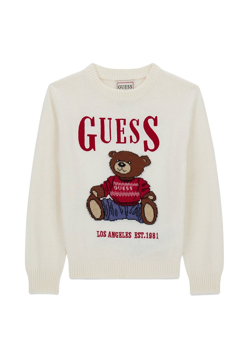 Pull en tricot blanc cassé arborant un graphisme d'ours en rouge et marron, avec le texte "GUESS" au-dessus et "LOS ANGELES EST. 1981" en dessous.