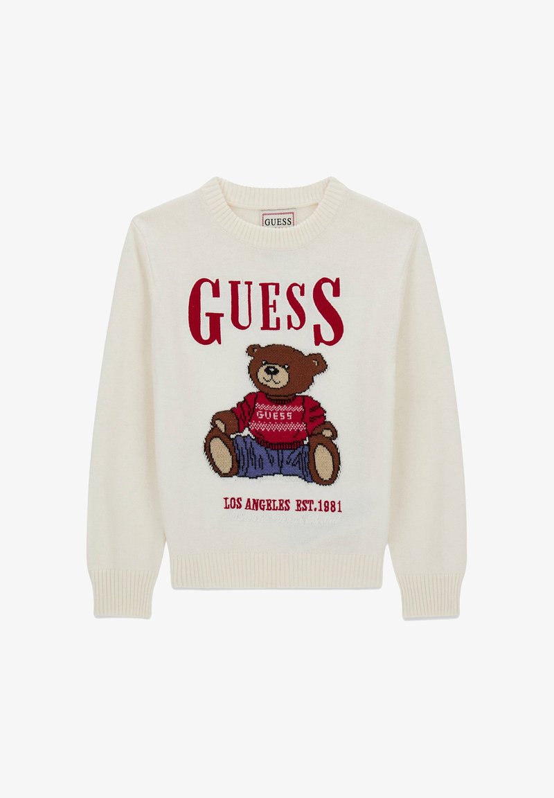 Krem pleteni pulover s grafikom medvjeda u crvenoj i smeđoj boji, s tekstom "GUESS" iznad i "LOS ANGELES EST. 1981" ispod.