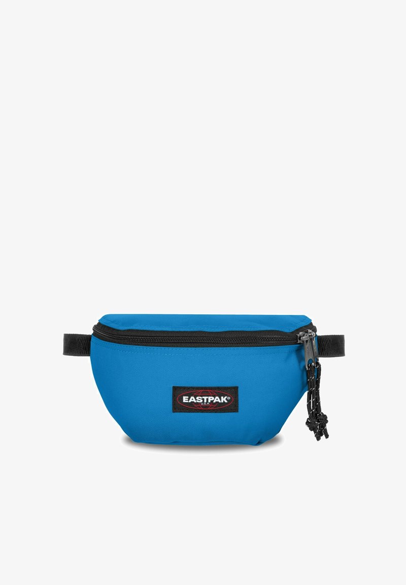 Borsa vita in tessuto blu con chiusura a zip, dettagli neri e etichetta con logo. Forma arrotondata con una tracolla laterale e superficie testurizzata.